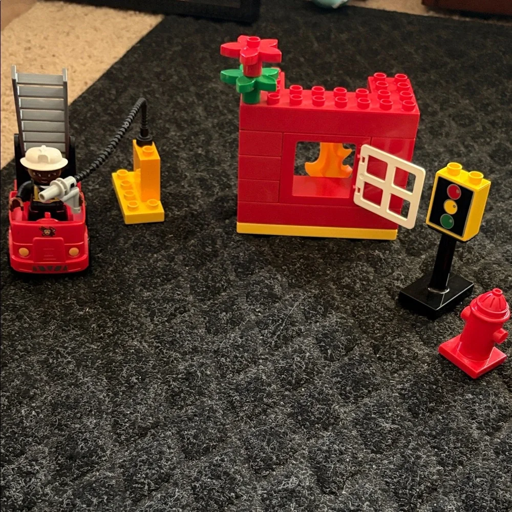 Lego Duplo Fire Truck With Firefighter Figure with fire hydrant and flame pieces